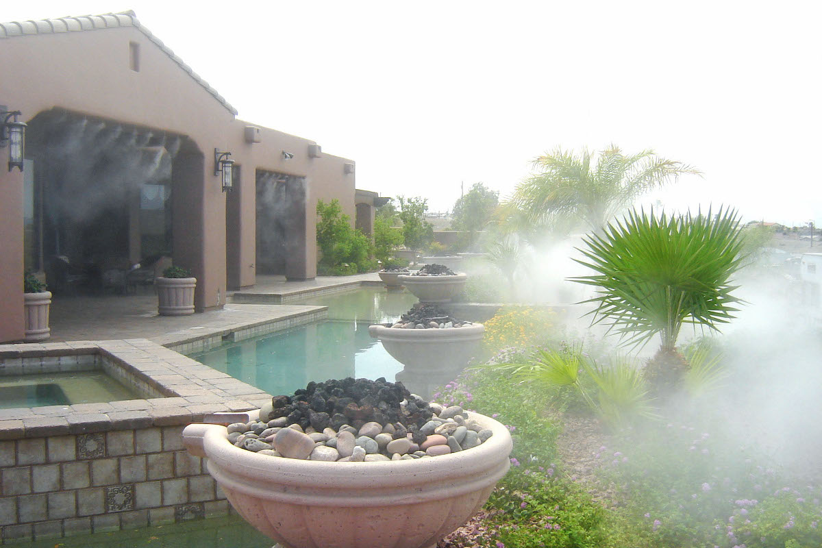 misting system in yard of house